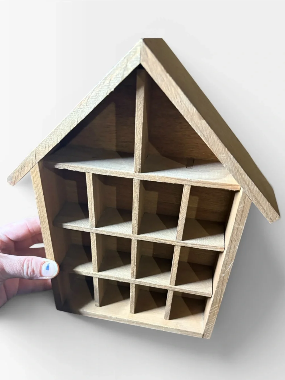Small house trinket shelf hung by wire